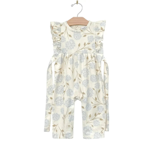Made with the softest 100% combed cotton jersey. Featuring coconut buttons on back, a wrap around tie, and flutters on the shoulders. In our all over Hydrangea print