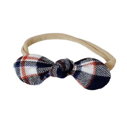 The perfect hair accessory for your precious little girl in our limited edition Navy and Orange Plaid color!
Due to the nature of how our Limited Edition fabrics are