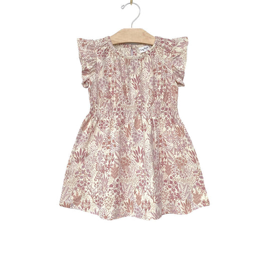 Made with the softest 100% combed cotton jersey. Featuring sleeve ruffles and a soft elastic shirred waist for optimal comfort and fit. In our all over Pastel Garden