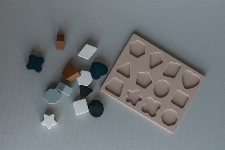 Our mini shape puzzle is perfect for the little problem solvers and shape learners in your life!
It’s made of 100% food-grade silicone, so it’s easy to clean, soft o