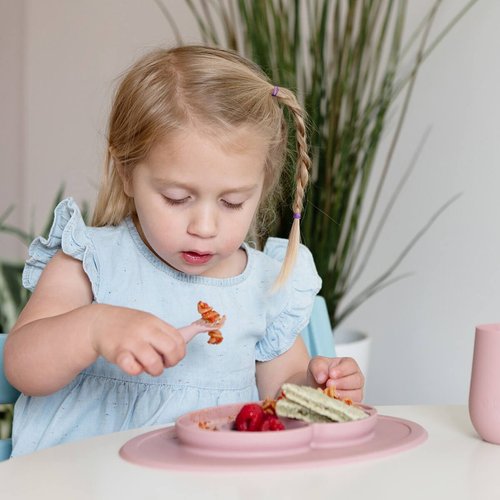 Learning to self-feed is an important developmental milestone, and the ezpz Mini Utensils are designed to help toddler learn how to eat with a spoon (scooping) and