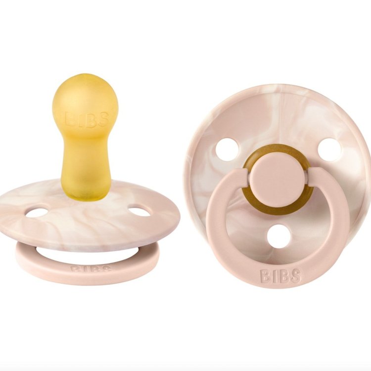 Our Colour pacifier is the original BIBS pacifier and has been on the market for over 40 years. It has the signature round BIBS shield with three vent holes and rou