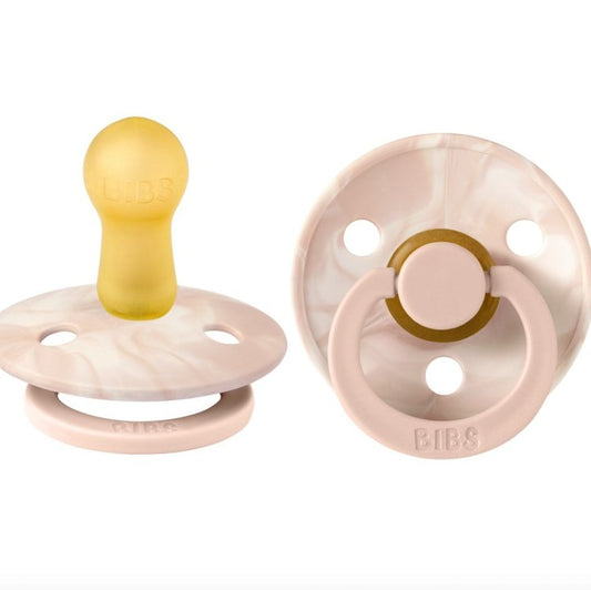 Our Colour pacifier is the original BIBS pacifier and has been on the market for over 40 years. It has the signature round BIBS shield with three vent holes and rou