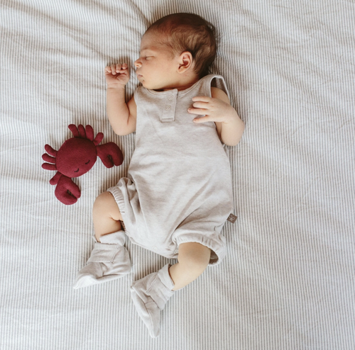 Never lose another sock. A super-soft organic baby boot that is adjustable and stays on no matter what. Featuring our two-part adjustable closure system that remains