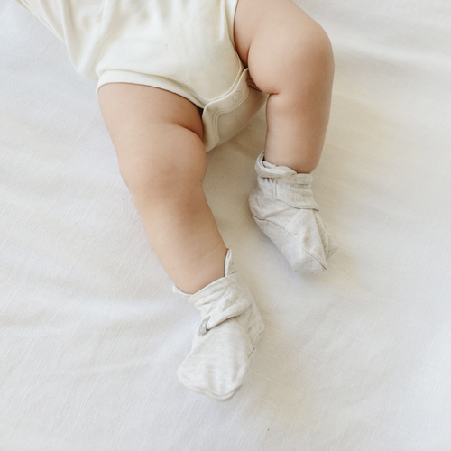 Never lose another sock. A super-soft organic baby boot that is adjustable and stays on no matter what. Featuring our two-part adjustable closure system that remains