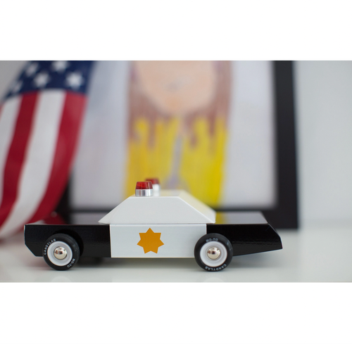 Boxy and assertive, shiny black-and-white paint scheme, gold star and with two cherries on top. Making sure racing stays at the track.
Materials & Info: Solid Be