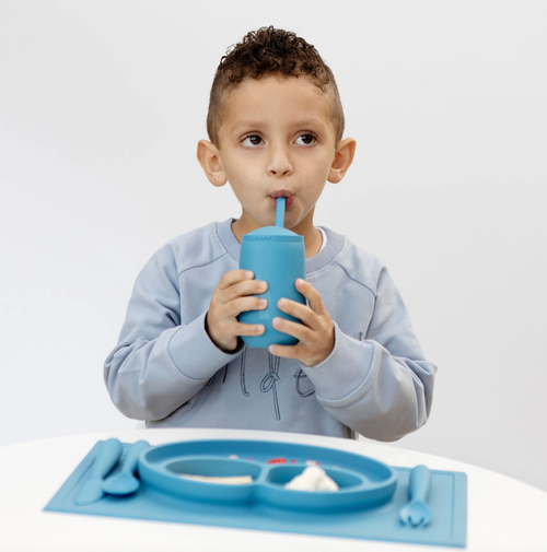 Learning to drink from a straw is an important developmental milestone that develops lip rounding and promotes speech development. The ezpz Happy Cup + Straw System