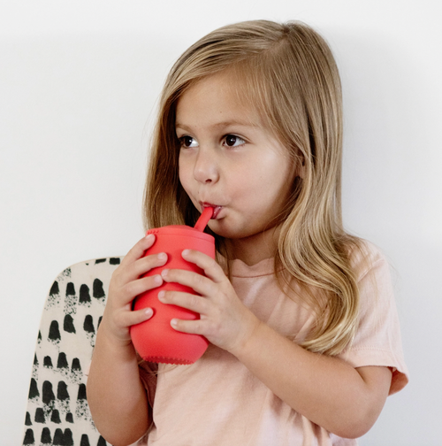 Learning to drink from a straw is an important developmental milestone that develops lip rounding and promotes speech development. The ezpz Happy Cup + Straw System