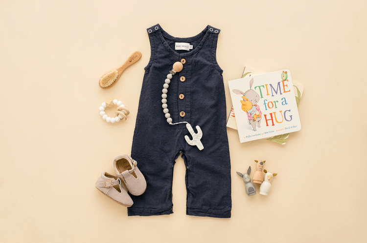 With classic, neutral styles and beautiful details that let your babe’s personality shine, these rompers are a perfect choice for pregnancy reveal photos, month