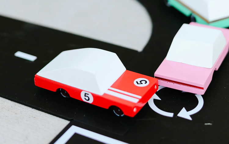 Smoking tires all day long, and chasing speed at the track. Part of our new candycar line, a cute 3 inches long. One of two of our racers, who said speed comes with