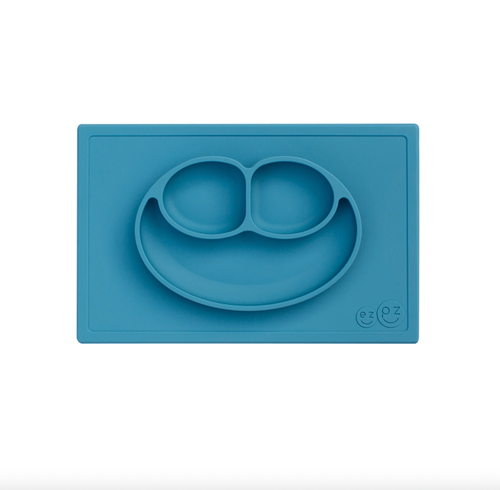 The Happy Mat is ezpz's award-winning flagship product. It is an all-in-one placemat + plate that suctions to the table, which means that it captures the mess and