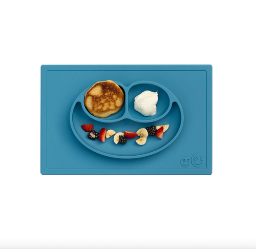 The Happy Mat is ezpz's award-winning flagship product. It is an all-in-one placemat + plate that suctions to the table, which means that it captures the mess and