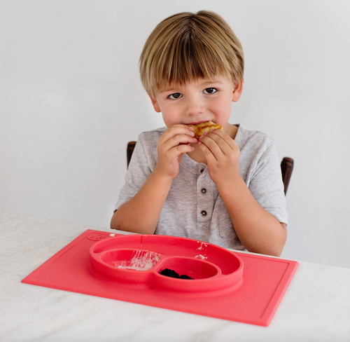 The Happy Mat is ezpz's award-winning flagship product. It is an all-in-one placemat + plate that suctions to the table, which means that it captures the mess and r