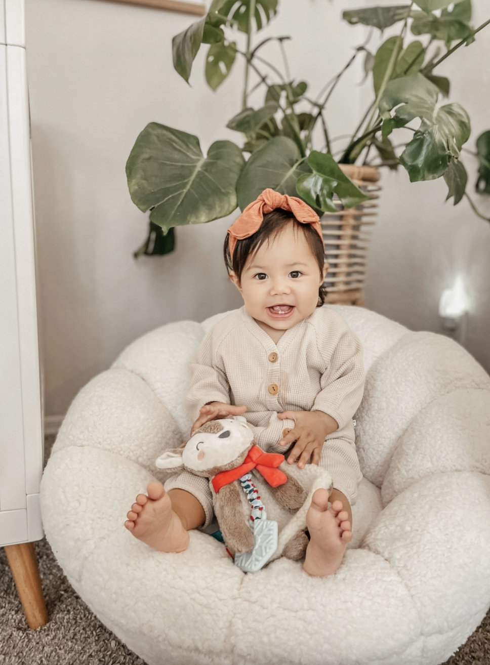 Cuddle & Bond! Our snuggly Itzy Lovey™ features soft sherpa fabric and textured ribbons that baby will love to explore! A textured silicone teether helps massage