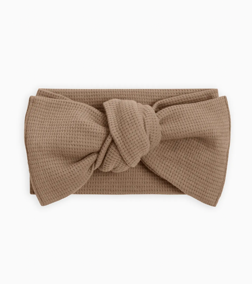 Every adorable outfit needs the perfect accessory! This adjustable tie bow wrap made from organic waffle knit fabric is the perfect accessory to elevate any outfit,