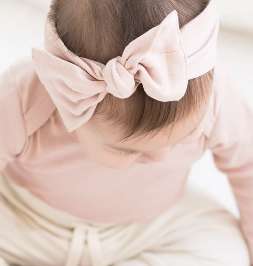 Every adorable outfit needs the perfect accessory! This adjustable tie bow wrap is the perfect accessory to elevate any outfit, without being itchy or irritating to