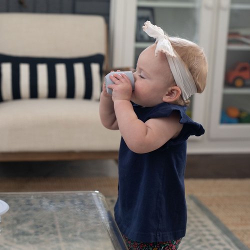Learning to drink out of an open cup is an important developmental milestone, and the Tiny Cup helps baby transition from bottle to cup. Open cup drinking supports