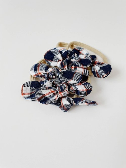 The perfect hair accessory for your precious little girl in our limited edition Navy and Orange Plaid color!
Due to the nature of how our Limited Edition fabrics are