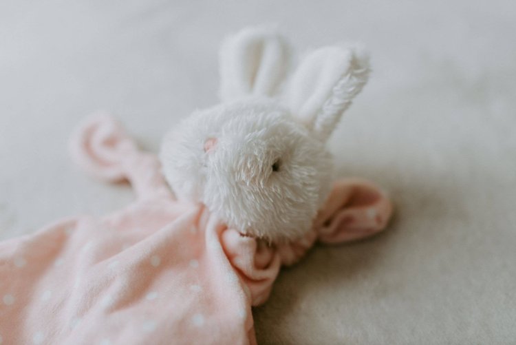 Our Knotty Friend loveys have won the hearts of wee one's around the world. A sweet fur baby-safe embroidered face with velour floppy body in sweet pink with cream p