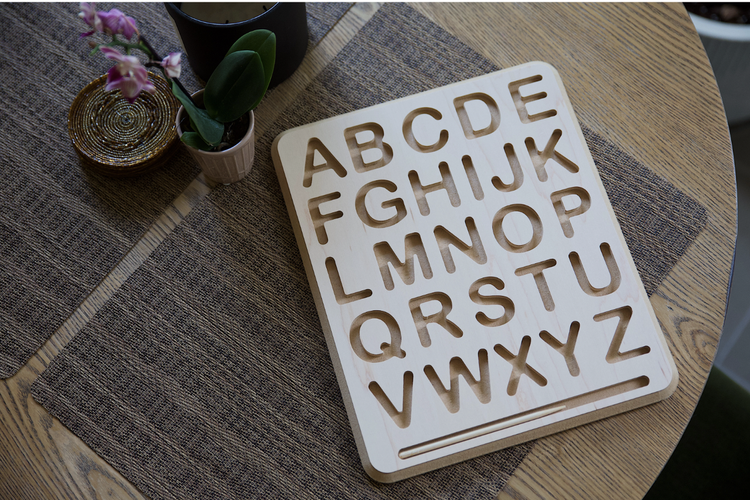 The Montessori approach recognizes that a child’s potential for learning is greatest when provided with tactile, multisensory tools. A letter tracing board capitaliz