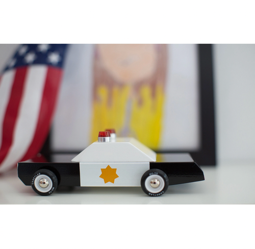 Boxy and assertive, shiny black-and-white paint scheme, gold star and with two cherries on top. Making sure racing stays at the track.
Materials &amp; Info: Solid Be