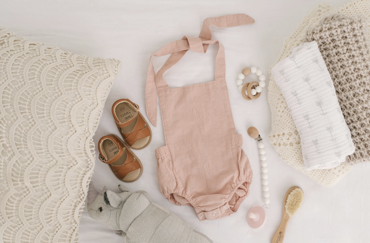 

With classic, neutral styles and beautiful details that let your babe’s personality shine, these rompers are a perfect choice for pregnancy reveal photos, monthly 