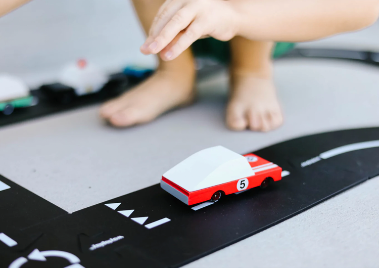 Smoking tires all day long, and chasing speed at the track. Part of our new candycar line, a cute 3 inches long. One of two of our racers, who said speed comes with 