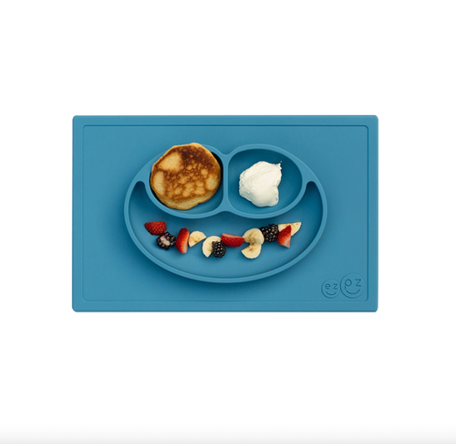 

The Happy Mat is ezpz's award-winning flagship product. It is an all-in-one placemat + plate that suctions to the table, which means that it captures the mess and 