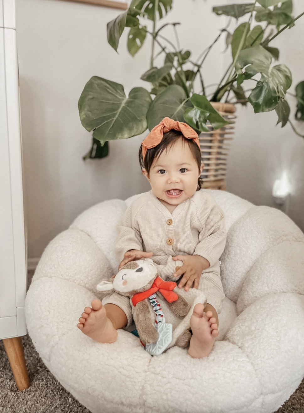 Cuddle &amp; Bond! Our snuggly Itzy Lovey™ features soft sherpa fabric and textured ribbons that baby will love to explore! A textured silicone teether helps massage