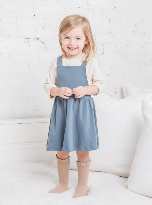



Our Jolie Jumper is perfect for layering with one of our long sleeve tops and dressing up any outfit. With super soft fabric and an elastic waistband, your littl