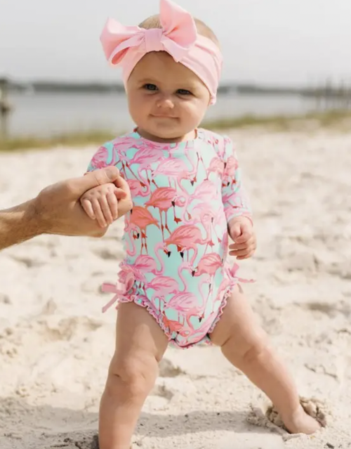 
A wonderful addition to your little girl's swimwear, this One Piece Rash Guard is comfort and style rolled into one. Made with sun protected fabric for all day prot