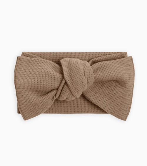 Every adorable outfit needs the perfect accessory! This adjustable tie bow wrap made from organic waffle knit fabric is the perfect accessory to elevate any outfit, 