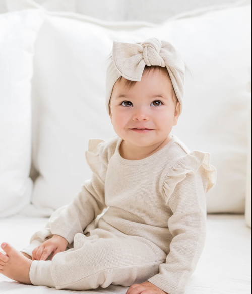 Every adorable outfit needs the perfect accessory! This adjustable tie bow wrap made from organic waffle knit fabric is the perfect accessory to elevate any outfit, 